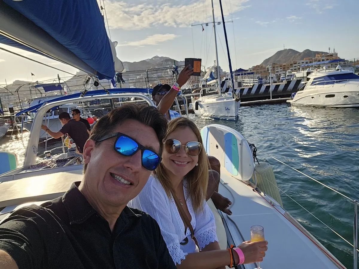 Costin Rizan, Founder of StayFn, with his wife on a boat in a harbour